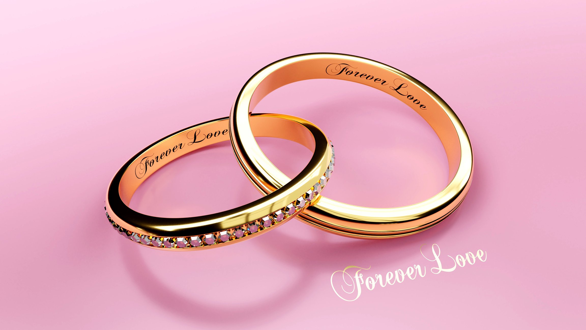 Golden wedding rings with engraved words, 3d illustration